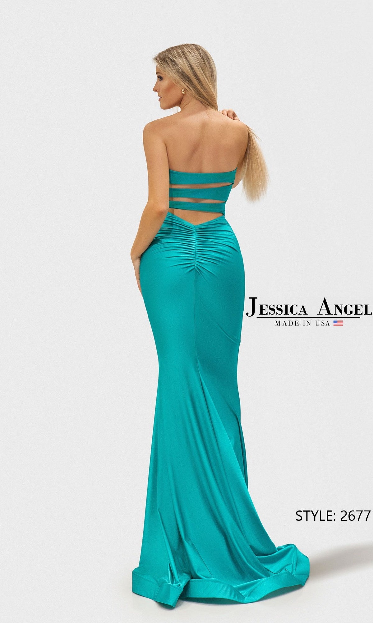 Woman in a floor-length teal mermaid gown with strappy open back and slight train, posing against a light background. Text: